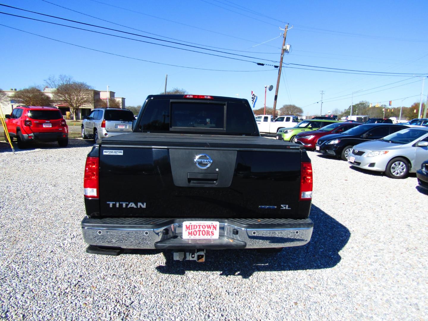 2011 Black /Tan Nissan Titan (1N6BA0ED1BN) , Automatic transmission, located at 15016 S Hwy 231, Midland City, AL, 36350, (334) 983-3001, 31.306210, -85.495277 - Photo#6